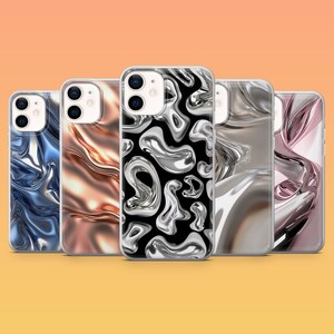 May include: Five phone cases with abstract designs. The cases feature a variety of colors and patterns, including blue, copper, silver, and pink. One case has a black background with silver shapes.