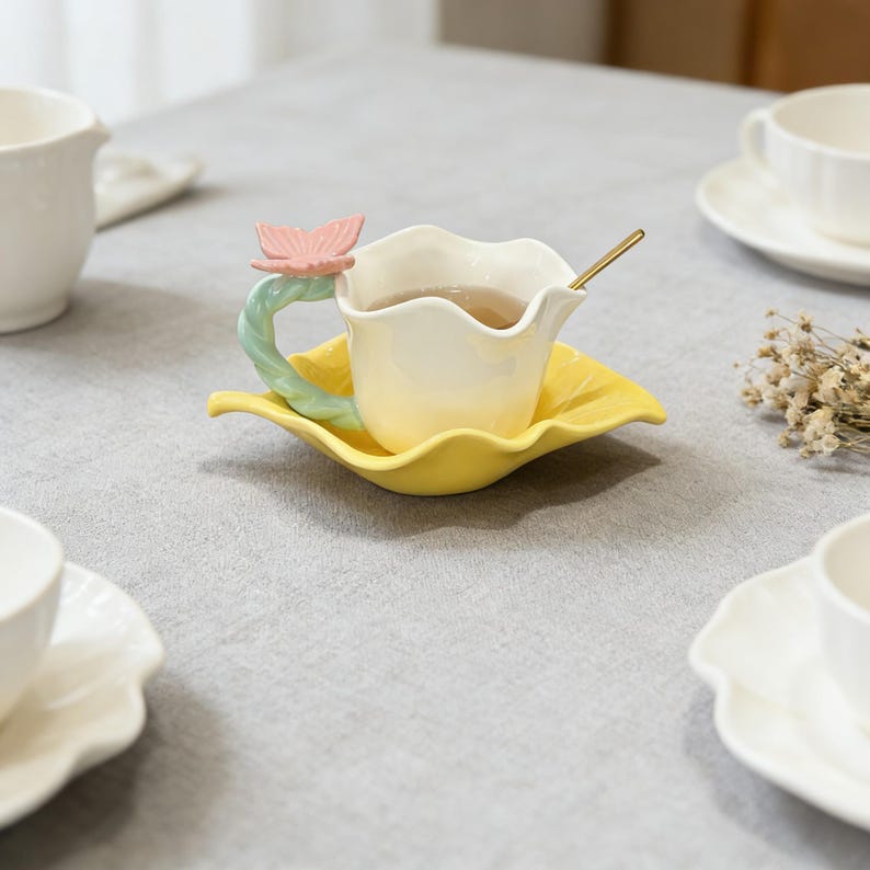 handmade ceramic mug butterfly handle floral design close up