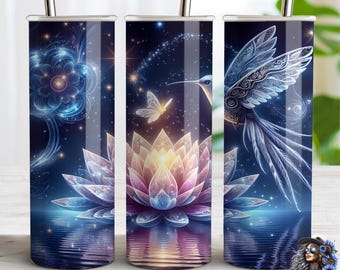 May include: Three stainless steel tumblers with a celestial design. Each tumbler features a different element of the design: a blue floral pattern, a lotus flower with a butterfly, and a hummingbird. The design is set against a dark blue background.