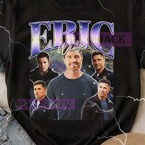 May include: Black t-shirt featuring a graphic of Eric Winter with his name in a purple and blue design. The shirt includes multiple images of Eric Winter. The design has a vintage, retro style.