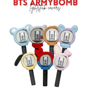 May include: A collection of BTS ARMYBOMB lightstick covers in various colors, including blue, gray, orange, purple, yellow, red, and pink. Each cover features a unique animal-themed design, such as bears and bunnies, and the BTS logo.