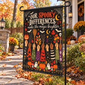 May include: A black garden flag featuring the text "OUR SPOOKY DIFFERENCES make the magic brighter" with illustrations of hands holding various autumn and Halloween items like pumpkins, a broom, candy corn, and flowers, plus ghosts and cats.