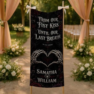 May include: A vertical black fabric banner featuring the white text "FROM OUR FIRST KISS UNTIL OUR LAST BREATH", the date "9/15/2026", and the names "SAMATHA" and "WILLIAM" with a skull heart icon, accented by two skeletal hands forming a heart.