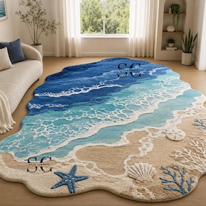 May include: An irregular shaped area rug featuring a coastal scene with deep blue ocean waves, white sea foam, and a sandy beach shore. The design includes a blue starfish, a white seashell, a sand dollar, and blue coral accents on the sand.
