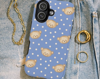 May include: A light blue phone case featuring a pattern of small, white polka dots and adorable teddy bear illustrations. The case has a black border and cutouts for the camera and buttons. A gold chain and rings are also visible.