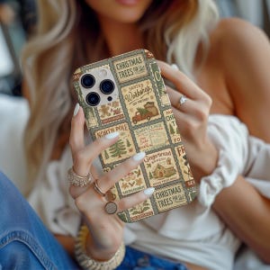 May include: A phone case with a Christmas-themed design. The case features a collage of vintage-style postage stamps with holiday imagery and text, including "Christmas Trees for Sale" and "Santa's Workshop."