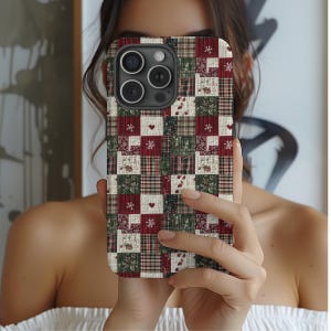 May include: A patchwork-style phone case featuring a mix of red, green, and cream-colored squares. The design includes heart and snowflake motifs, along with floral and plaid patterns. The case has a textured appearance.