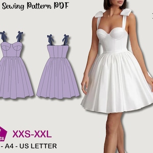 May include: A white dress with a sweetheart neckline and a flared skirt. The dress has thick straps with bows. The image also shows a sewing pattern of a lilac dress with bow straps. Text on the image reads "Sewing Pattern PDF", "Indiana Patterns", "7 Sizes", and "XXS-XXL".