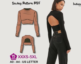 May include: A sewing pattern PDF featuring a long-sleeved crop top design with a back cutout. The pattern includes sizes from XXXS to 5XL and is available in A0-A4 and US Letter formats. The Indiana Patterns logo is visible.