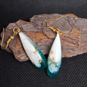 Green, white and gold dangling earrings