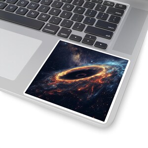 May include: A square sticker featuring a vibrant depiction of a black hole in space. The artwork showcases a swirling vortex of orange, red, and blue hues, set against a dark, starry background. The sticker is placed on a laptop's trackpad.
