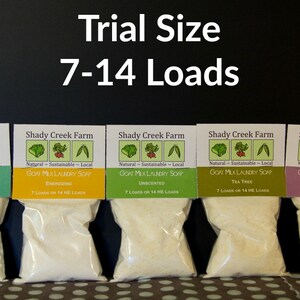 May include: Five small bags of goat milk laundry soap in trial size, each containing 7-14 loads. The bags are labeled with different scents: Eucalyptus, Energizing, Unscented, Tea Tree, and Lavender.