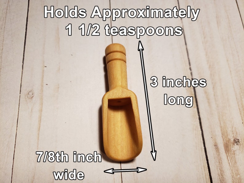 May include: A small wooden scoop, 3 inches long and 7/8 inch wide, holds approximately 1 1/2 teaspoons.