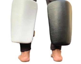 Almohadilla de patada de pantorrilla para entrenamiento de Muay Thai/Kickboxing, cuero de búfalo ligero.