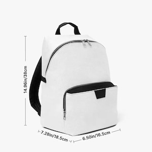 May include: White backpack with black accents, featuring a front pocket and a top handle. The backpack measures 14.96 inches (38cm) in height, 6.50 inches (16.5cm) in width, and 7.28 inches (18.5cm) in depth. It has a zippered main compartment and a smaller front pocket.