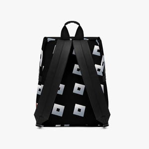May include: Black backpack with a repeating pattern of silver squares. The backpack has black shoulder straps, a top handle, and a rectangular shape. The design is modern and geometric, suitable for everyday use.