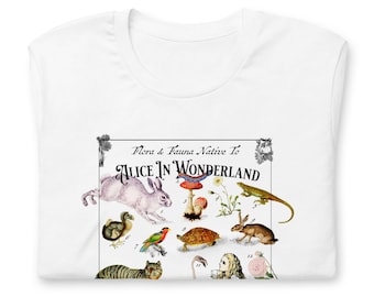 May include: A white t-shirt featuring a graphic print titled Flora & Fauna Native To Alice In Wonderland. The design includes numbered illustrations of a rabbit, a caterpillar on a mushroom, a lizard, a dodo, a bird, a turtle, and a cat.