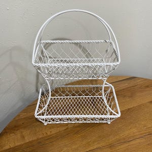 Large two-tier white painted twisted wire basket stand