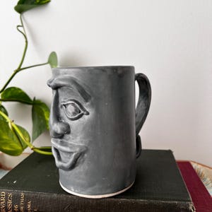 Handmade Pottery Face Mug – Gray Glaze Folk Art Studio Pottery – Sculpted Ceramic Mug. Marked at the base