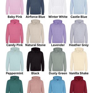 May include: A set of three ceramic mugs with a speckled, matte finish. The mugs are in shades of cream, light gray, and dark gray. Each mug has a simple, modern design and a rounded handle. The mugs are likely for coffee or tea.