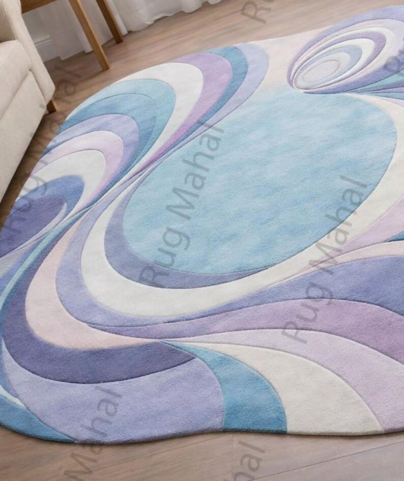 Abstract swirl shaped pastel area rug in blue, purple and white colors styled in a modern living room interior