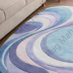 Abstract swirl shaped pastel area rug in blue, purple and white colors styled in a modern living room interior