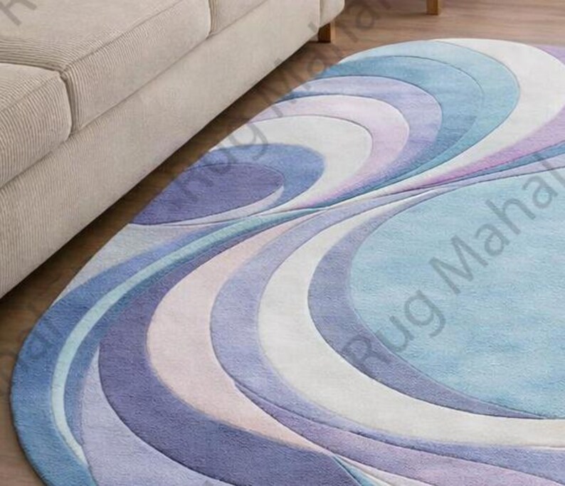 Abstract swirl shaped pastel area rug in blue, purple and white colors styled in a modern living room interior