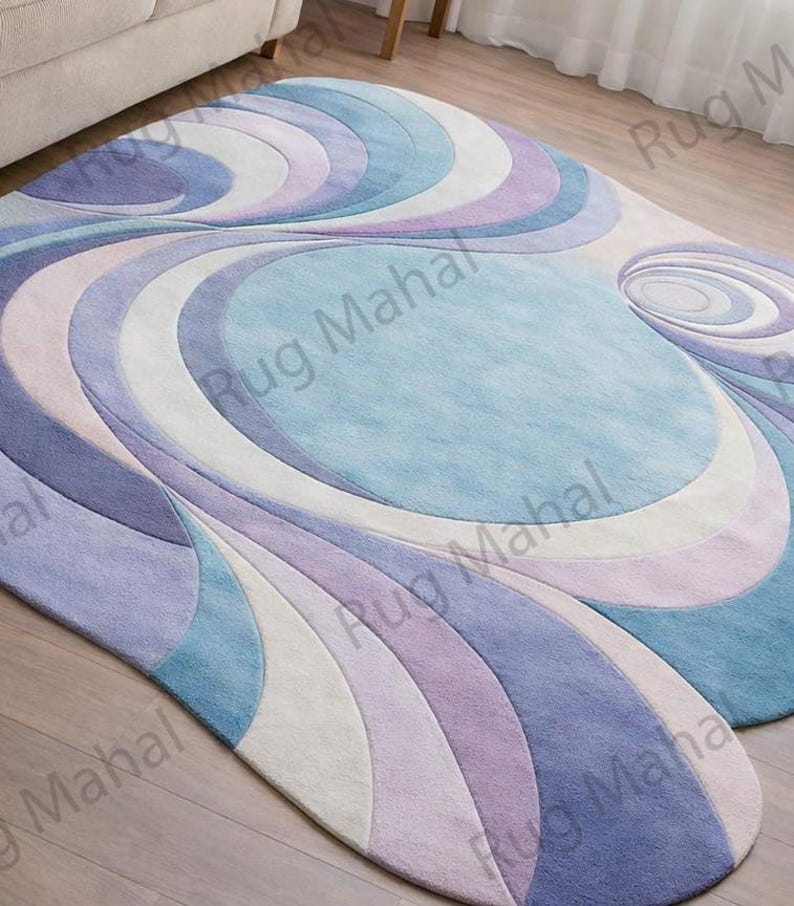 Abstract swirl shaped pastel area rug in blue, purple and white colors styled in a modern living room interior