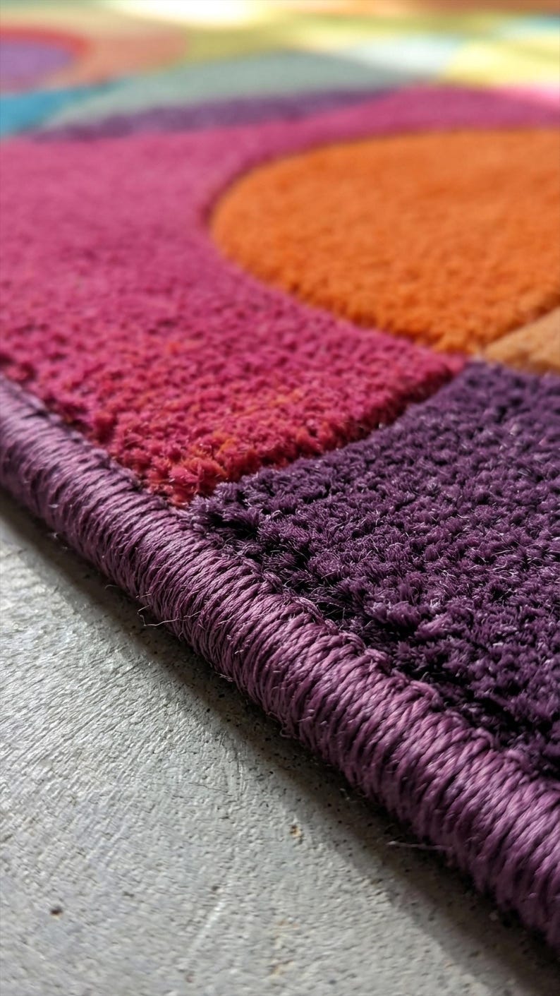 Close-up of rug edge showing clean finishing and thick tufted border.