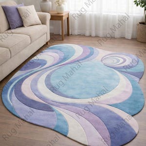Abstract swirl shaped pastel area rug in blue, purple and white colors styled in a modern living room interior