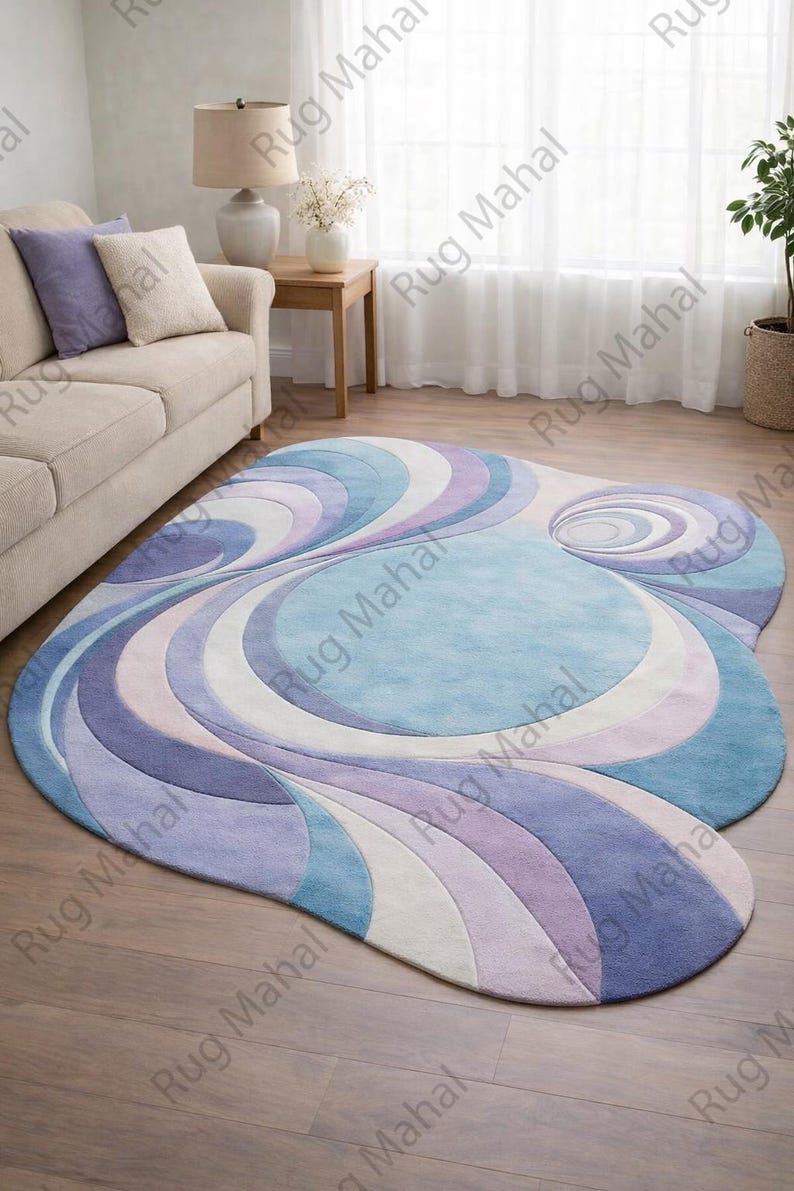 Abstract swirl shaped pastel area rug in blue, purple and white colors styled in a modern living room interior