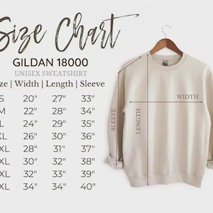 May include: A beige Gildan 18000 unisex sweatshirt hangs on a wooden hanger. The image includes a size chart with measurements in inches for width, length, and sleeve length, ranging from size small to 5XL.