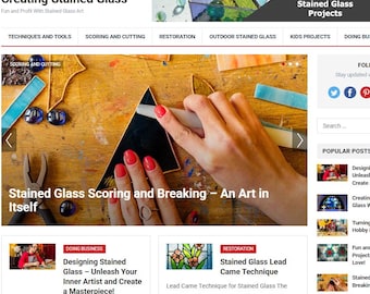 May include: Website homepage titled "Creating Stained Glass" with the tagline "Fun and Profit With Stained Glass Art." The page features articles on techniques, scoring, cutting, and restoration. A hand is shown scoring a piece of black glass. The site also has a search bar.