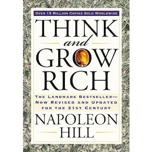 May include: A book cover for "Think and Grow Rich" by Napoleon Hill. The title is in large, bold black letters. The cover includes the text "Over 15 Million Copies Sold Worldwide" and "The Landmark Bestseller - Now Revised and Updated for the 21st Century."