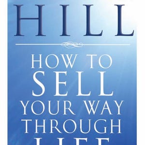 May include: A book cover with a blue gradient background. The title reads "Napoleon Hill" in large, dark blue letters. Below, in white, is "How to Sell Your Way Through Life". The author's name and book title are also visible.