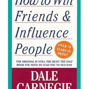 May include: A book cover titled How to Win Friends & Influence People by Dale Carnegie. The cover features dark blue text on a white background with a teal border, a maroon bottom section, and an orange starburst graphic stating Over 70 Years In Print.