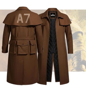 May include: A brown trench coat with a cape-like shoulder detail and multiple pockets. The back of the coat features the number "A7" in a light colour. The coat has a belt and a black quilted lining. The brand name "HASZAI" is visible on the label.