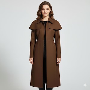 May include: A long, brown coat with a cape-like collar. The coat is knee-length and has a tailored fit. The model is wearing a black top underneath. The coat is made of a smooth fabric and has a classic design.