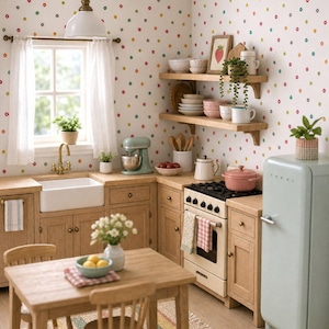 May include: A miniature kitchen scene featuring light wood cabinets, a white farmhouse sink, a mint green stand mixer, and a matching mint green refrigerator. The walls have colorful polka dots, and a wooden table with two chairs sits on a striped rug.