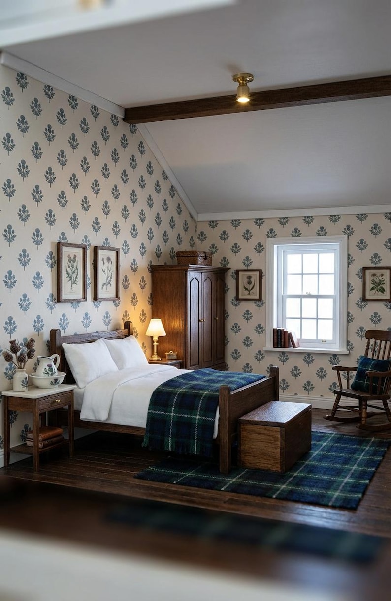 May include: A miniature bedroom scene featuring a wooden bed with white bedding and a blue and green plaid throw blanket. The room includes a wooden wardrobe, a rocking chair, a nightstand with a lamp, a wooden chest, and floral wallpaper.