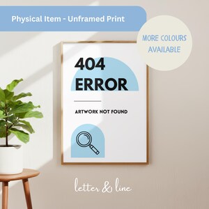 May include: An unframed print featuring the black text 404 ERROR and ARTWORK NOT FOUND on a white background. The design includes light blue semi-circular shapes and a black line drawing of a magnifying glass. The print is displayed in a thin wooden frame.
