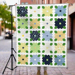 May include: A white ceramic mug with a black handle and the text "But First, Coffee" in a bold, black font. The mug is set against a neutral background, highlighting its simple design.