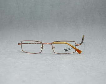 Vintage Eyeglasses Ray-Ban 6071 2531 by Loxuttica Italy 2010s. NOS Unworn. Unisex. Bronze. Available with Rx lenses. Regular size 47 19 135