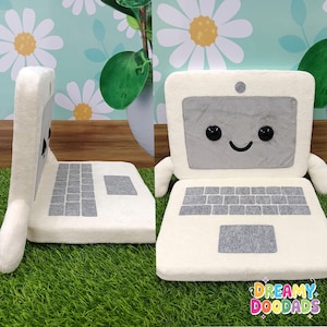 Kawaii computer plushie used as playful office decor and gift for programmer