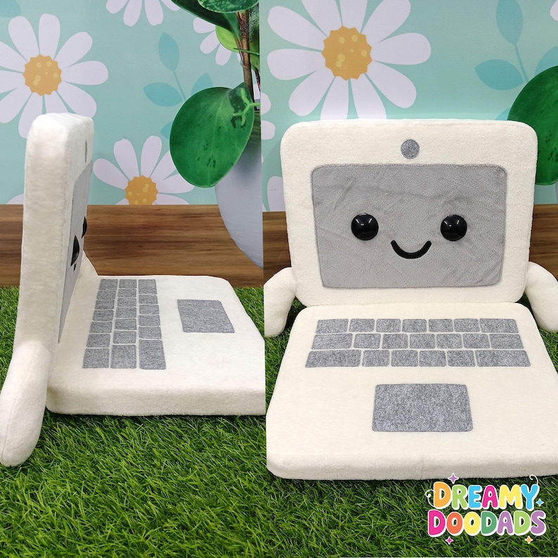 Kawaii computer plushie used as playful office decor and gift for programmer