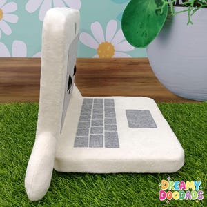 Plush laptop with adorable face, unique tech accessory for desk and workspace decor