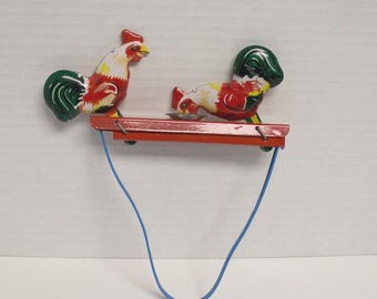 Tin Roosters hand squeezed toy 1880's