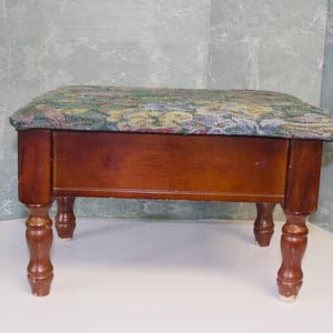 Vintage Powell footstool features a floral tapestry top and hinged lid for storage