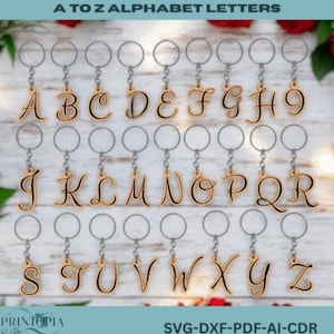 May include: A collection of gold-colored alphabet letter keychains, each with a silver keyring. The letters are in a cursive font. The image includes the text "A to Z Alphabet Letters" at the top. The keychains are displayed against a light background.
