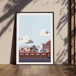 May include: Framed art print featuring a stylized illustration of a football stadium under a light blue sky with fluffy clouds. The stadium has red brick buildings and the text "FULHAM FOOTBALL CLUB".